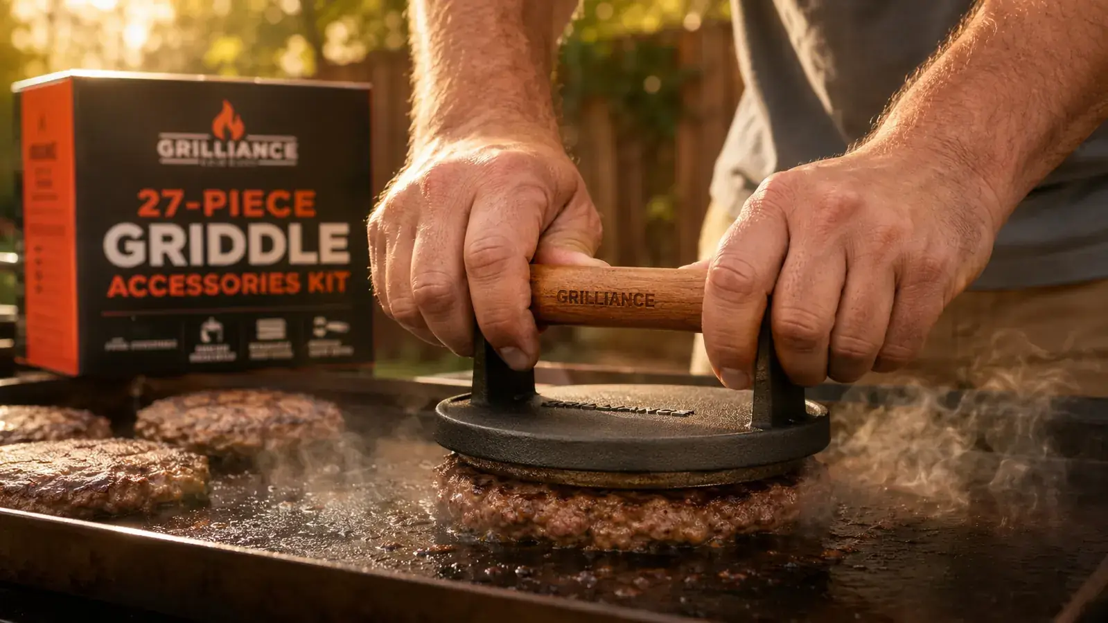 Hand holding a large professional spatula over a flat top griddle with smashing a burger patty